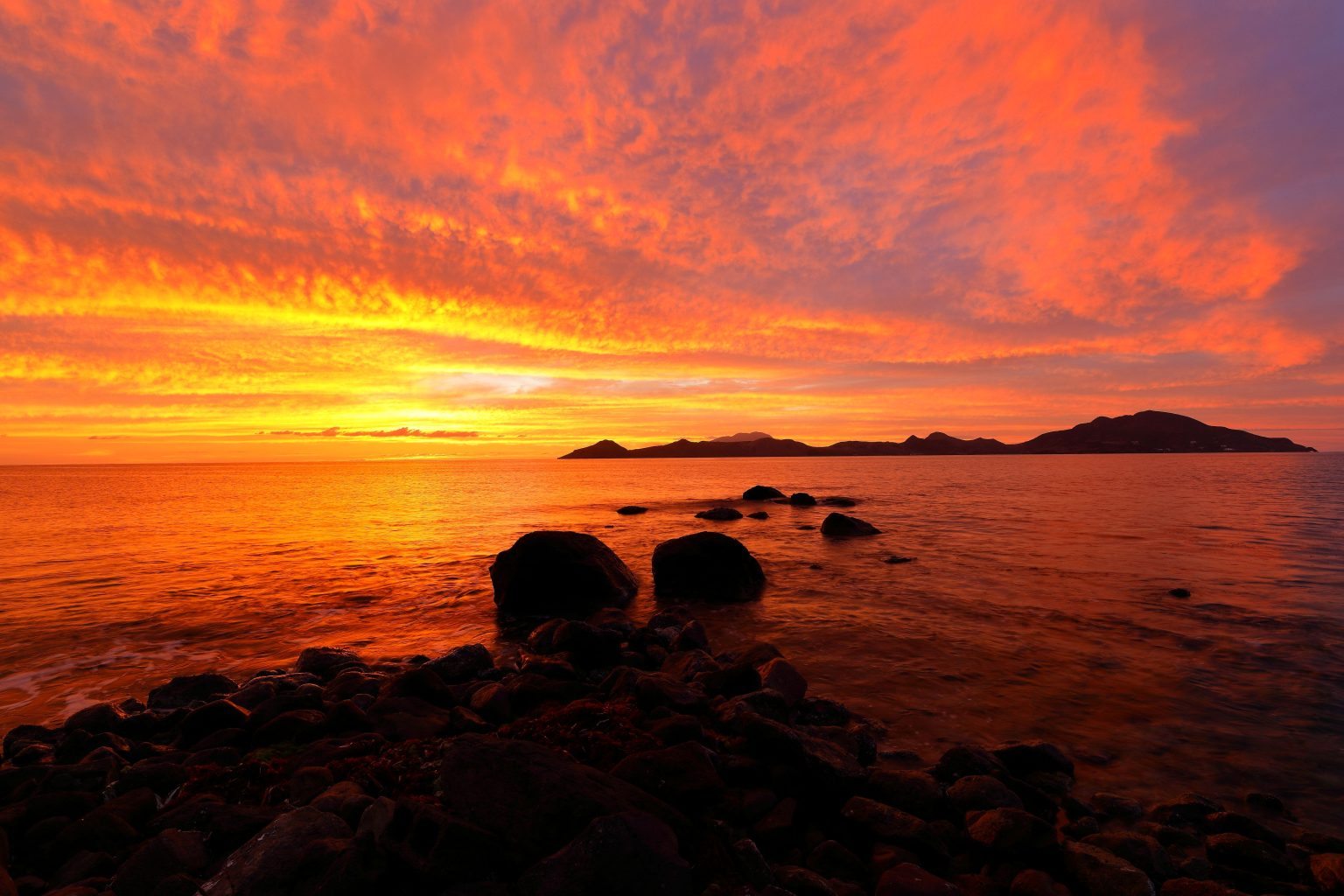A fisherfolk/sailor's delight, red skies at night. Tafari Ayinde of TAN Photography takes a look at St.Kitts from Nevis as the sunset colors the skies at twilight.
