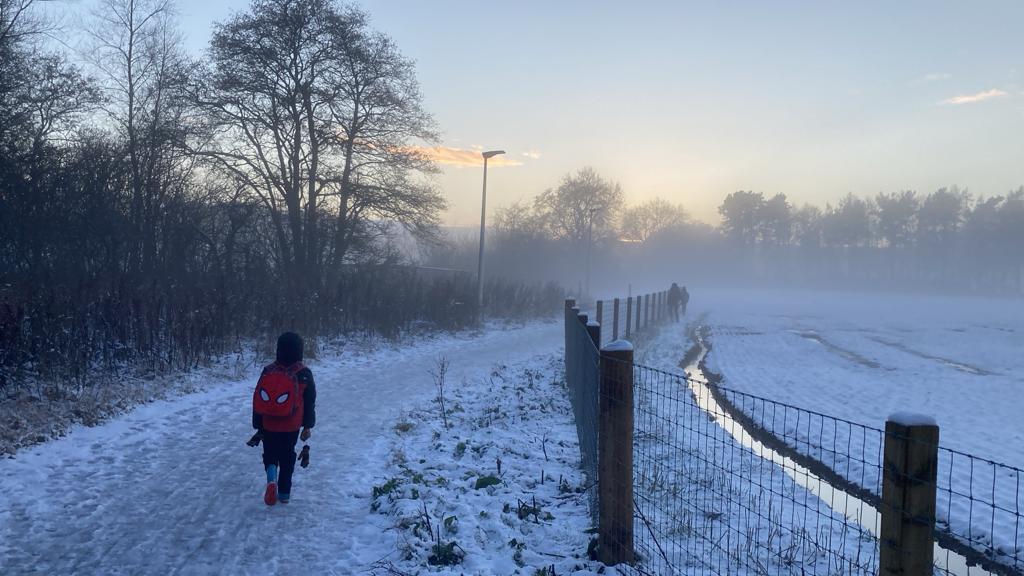 My submission depicts the following:
Each step carries a story forward. On a cold and quiet misty day, a child walks their own path towards the sunset, threading past, present and future into a solo journey. The path may fade, but the thread continues.