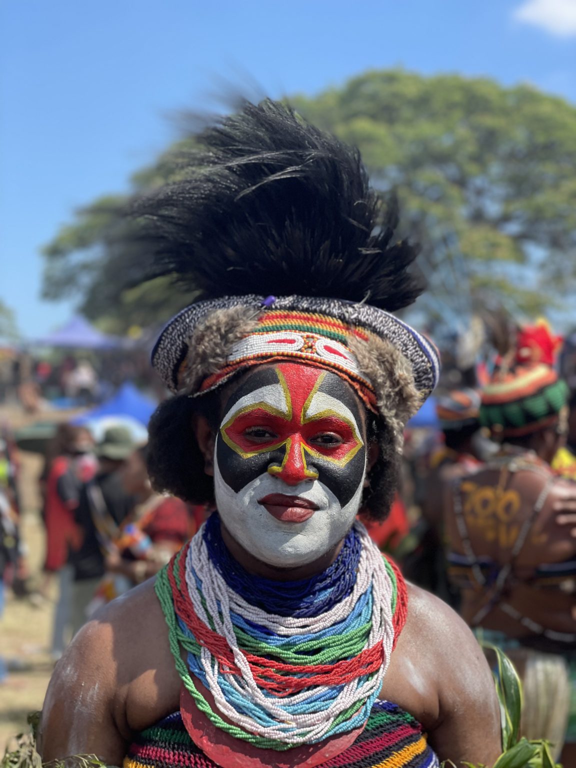 Traditional ‘bilas’ (attire) of the Southern Highlands Province in Papua New Guinea. 
This beautiful girl “Ambo Mopune” is from the Ialibu district of Southern Highlands province. Her face shows a beautiful face painting and she has an ostrich’s feathers as her head dress.