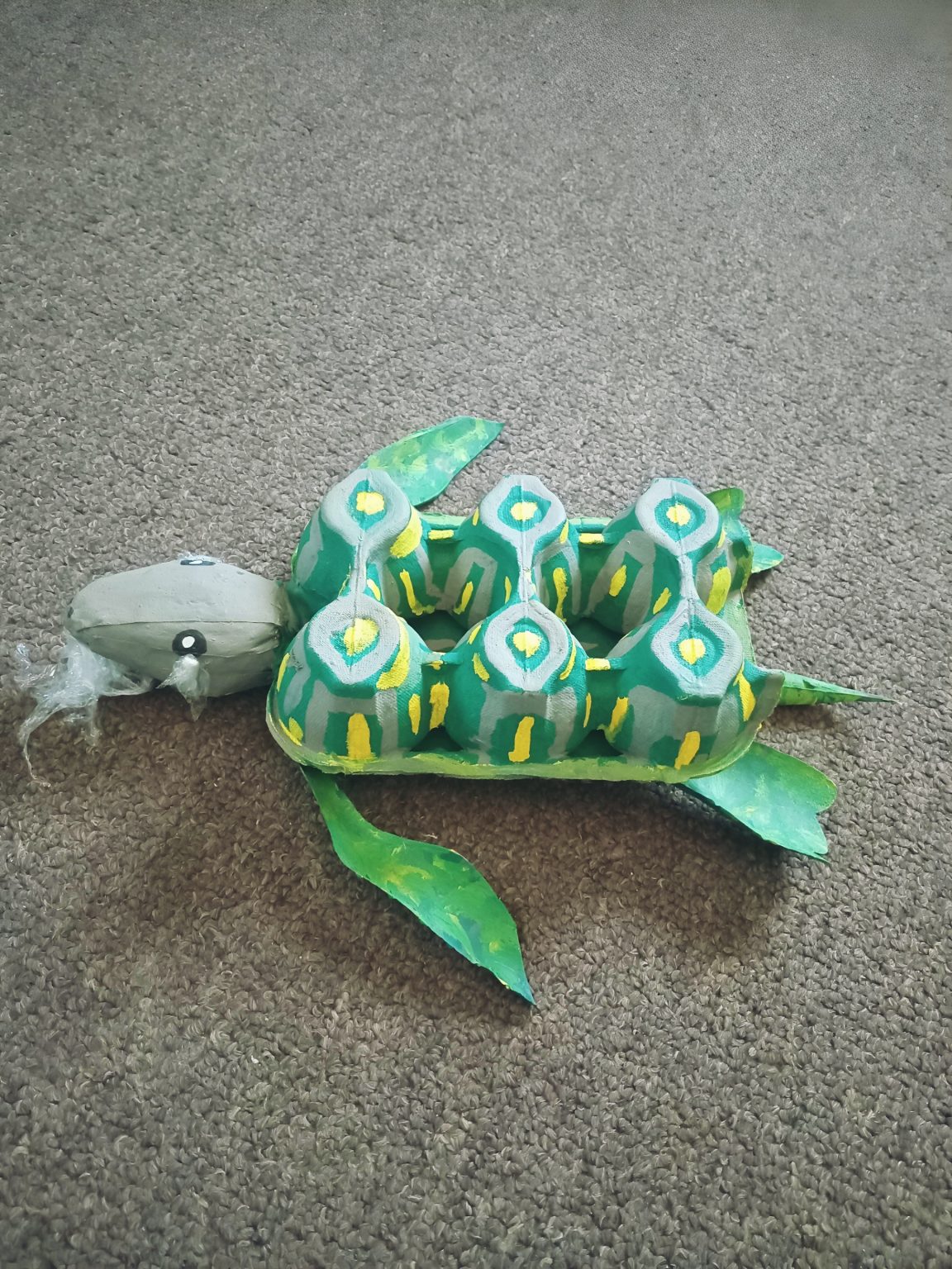 My submission is a crying sea turtle made from waste materials materials with plastic in it's mouth,symbolizing ocean pollution. It highlights how human plastic waste harms marine life and destroys natural habitats, calling for urgent action to protect our precious oceans.