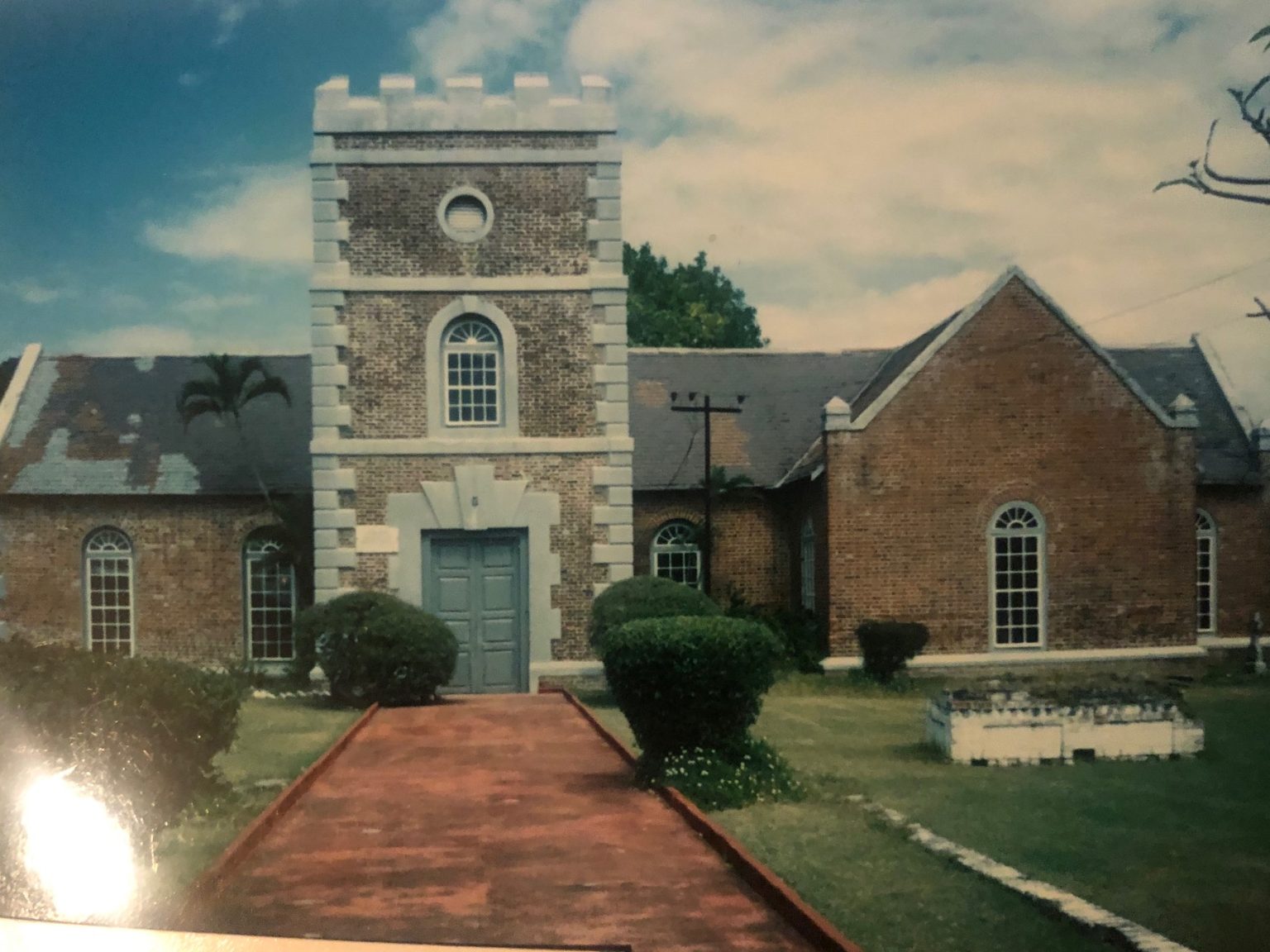 This photo taken in my youth, captures the church's historic architecture. With the wisdom of age, one is now also reminded of the intergenerational status quo of colonial Britain, where enslaved Africans and their decendants laboured on sugarcane plantations.

REPARATIONS NOW!